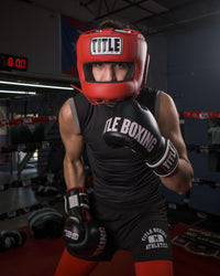 variant:Red::TITLE Boxing Face Protector Training Headgear man posing in headgear