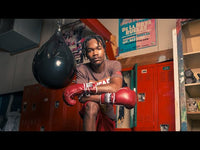 variant:maroon::TITLE Boxing Old School Leather Lace-Up Sparring Gloves  hands on knees