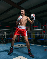 variant:red/white::TITLE Boxing Professional Traditional Cut Trunks guy smiling