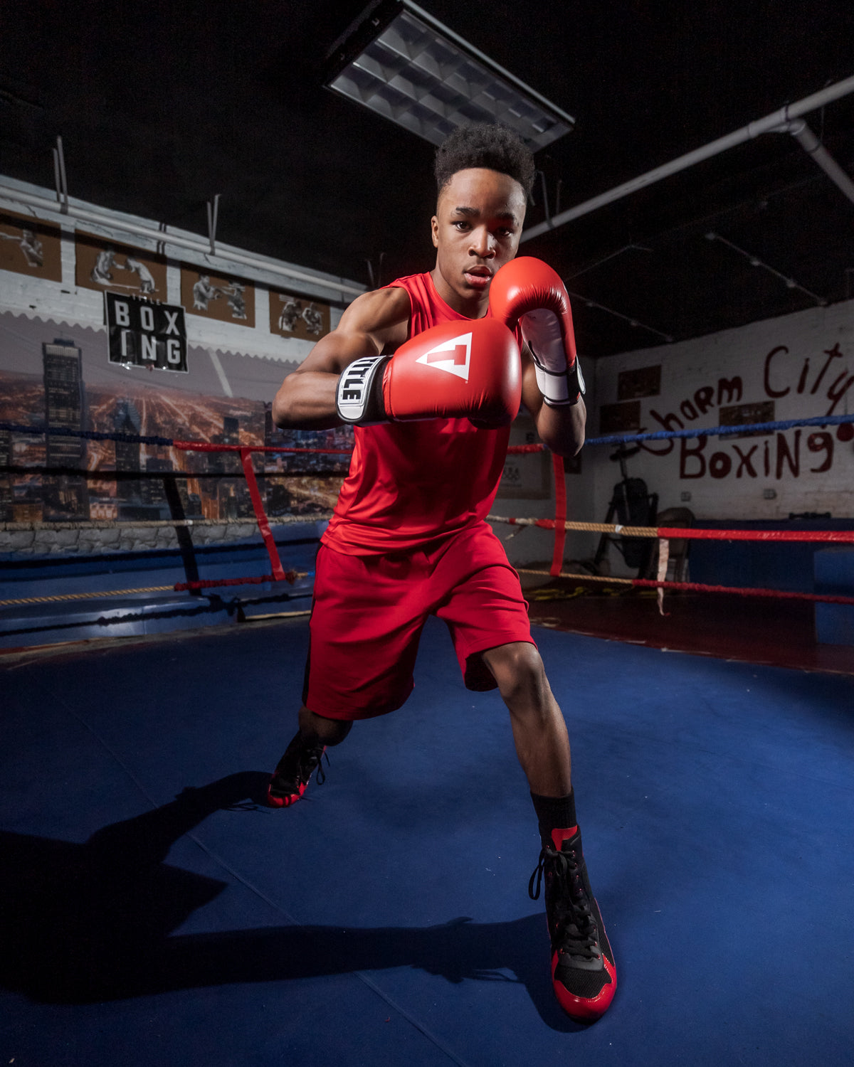 variant:Red/White::TITLE Premier Leather Super Bag Gloves 2.0 boy posing in ring