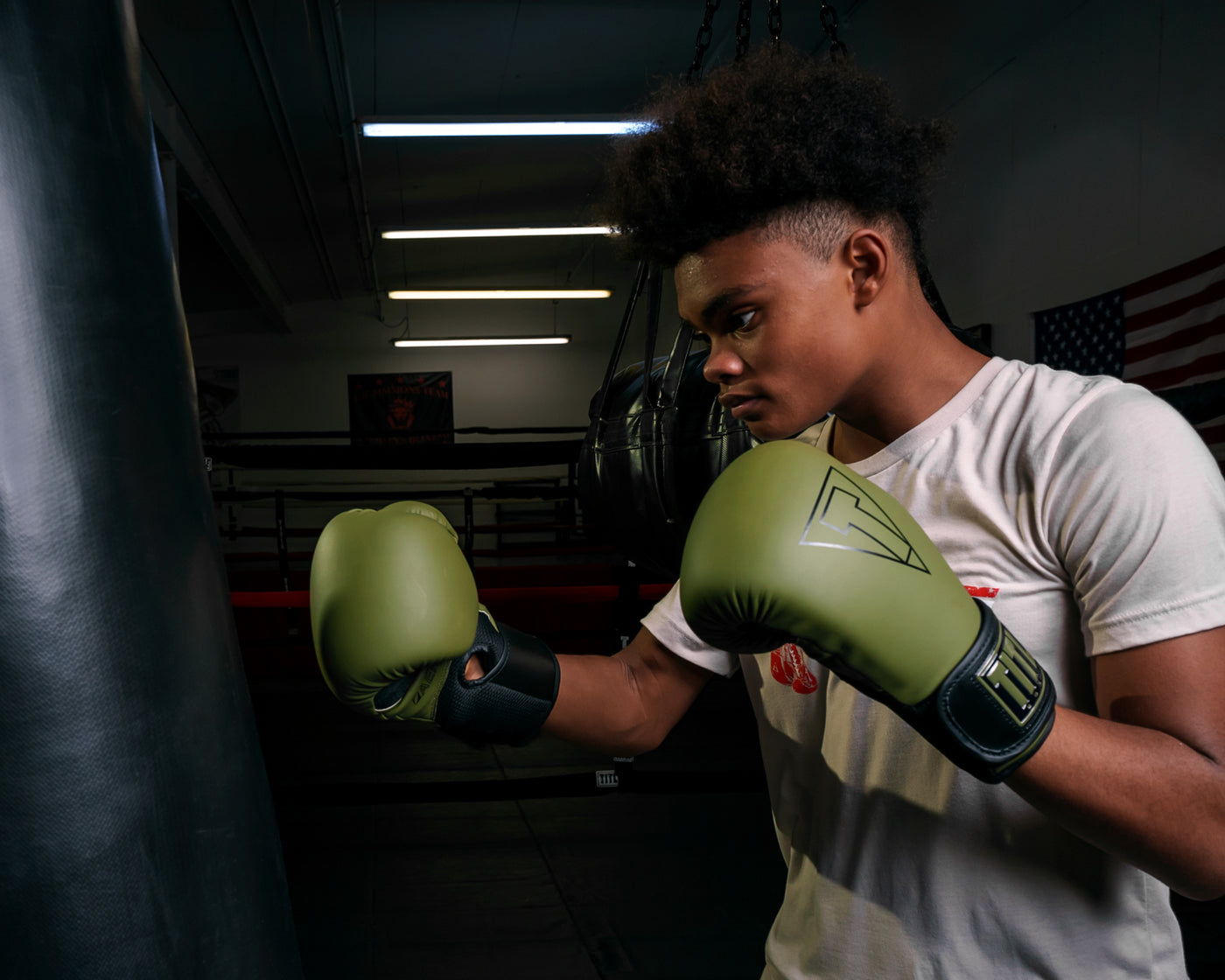 variant:Green/Black::TITLE Boxing Vegan Fitness Bag Gloves boy wearing gloves
