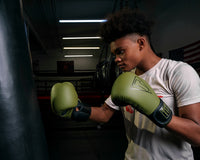 variant:Green/Black::TITLE Boxing Vegan Fitness Bag Gloves boy wearing gloves