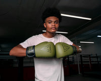 variant:Green/Black::TITLE Boxing Vegan Fitness Bag Gloves boy modeling gloves
