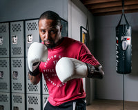 variant:White/Black::TITLE Boxing Vegan Fitness Bag Gloves man posing in gloves