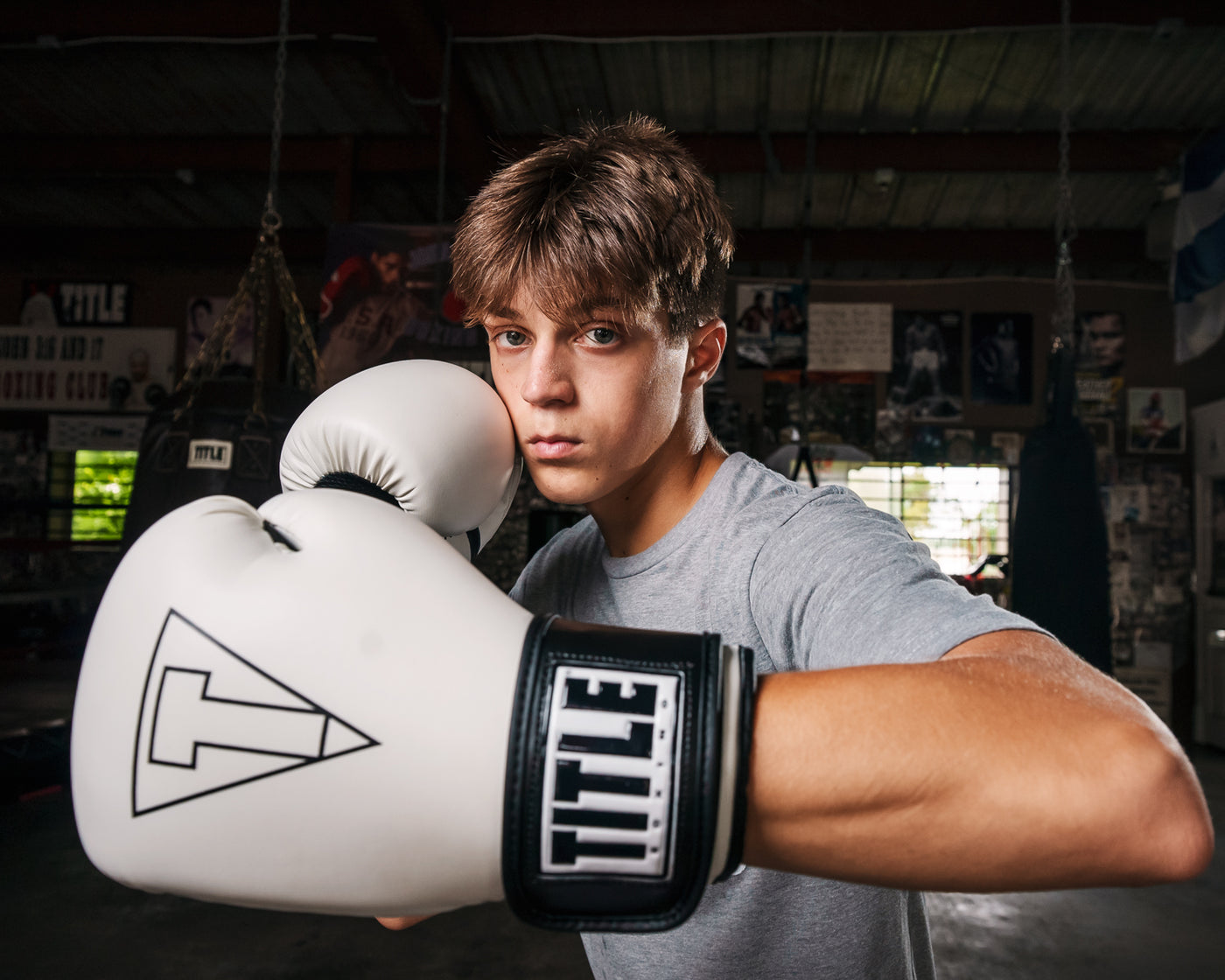 variant:White/Black::TITLE Boxing Vegan Fitness Bag Gloves boy posing in gloves