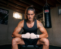 variant:White::TITLE Boxing Velpeau Amateur Competition 177" Wraps man sitting in chair hands wrapped