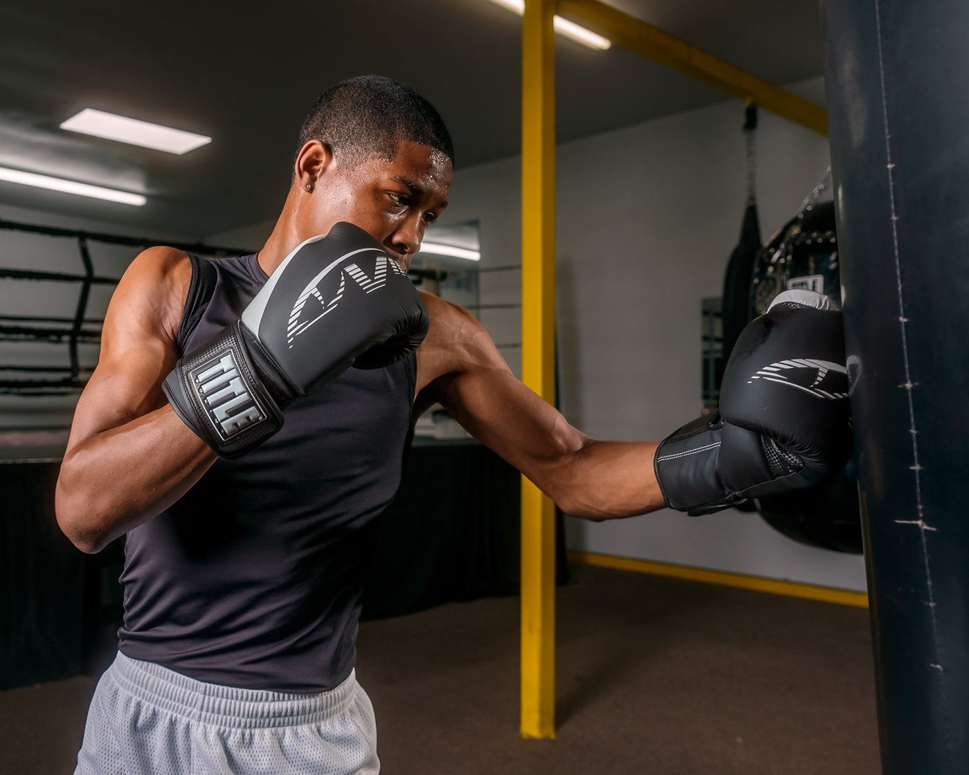 variant:Black/White::Viper by TITLE Boxing Strike Bag Gloves 2.0 man punching bag
