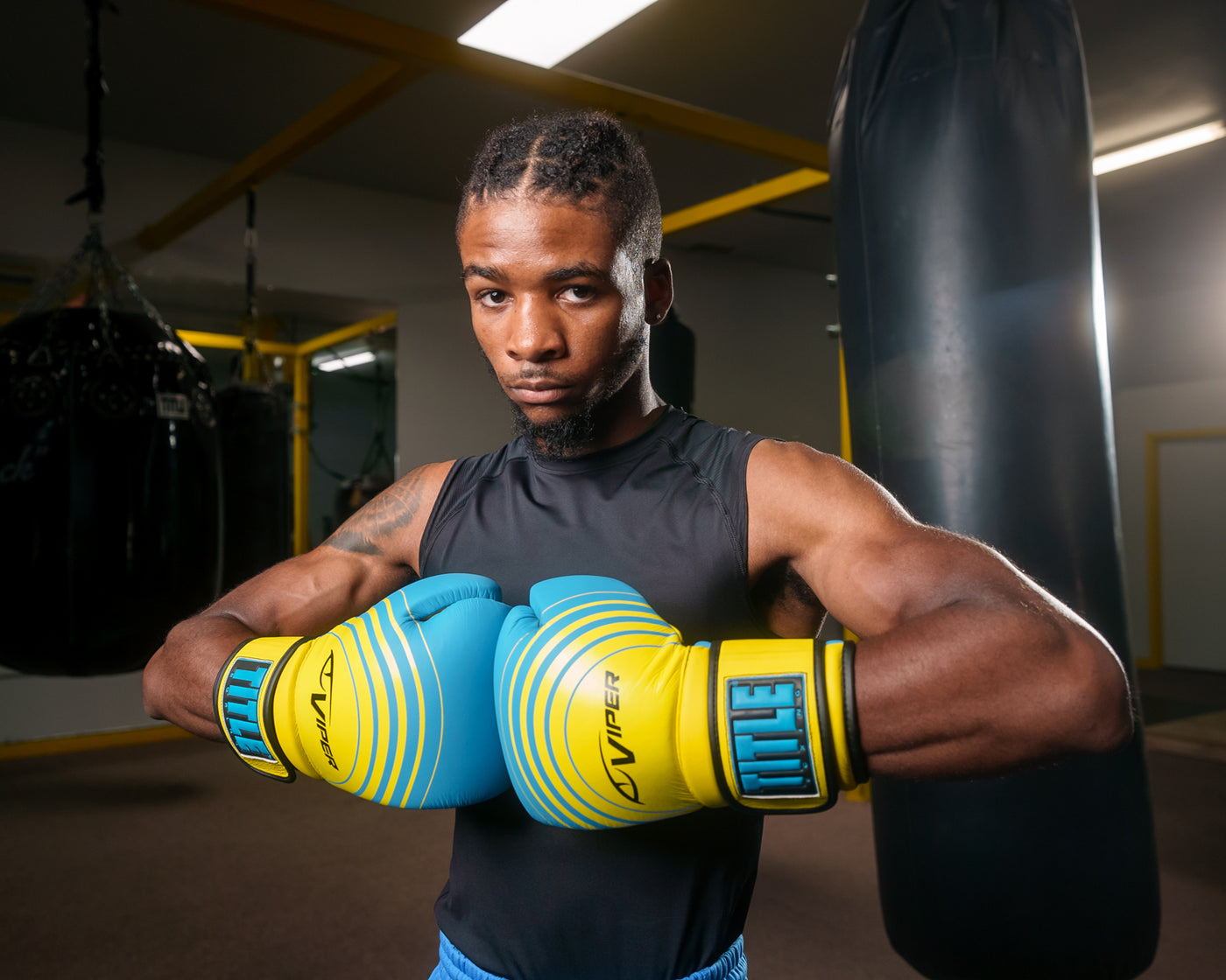 variant:Blue/Lime::Viper by TITLE Boxing Select Training Gloves 2.0 man posing with gloves
