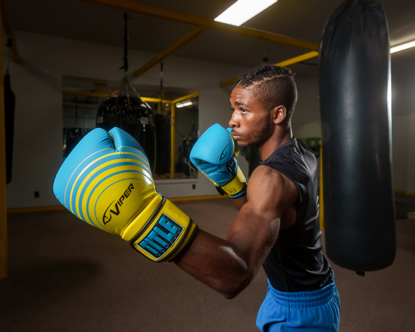 variant:Blue/Lime::Viper by TITLE Boxing Select Training Gloves 2.0 man posing wearing gloves
