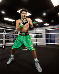 variant:Green/Black::WBC by TITLE Boxing Professional Boxing Trunks man modeling trunks