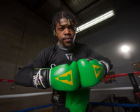 variant:Green/Black::WBC by TITLE Boxing Sparring Gloves man modeling gloves