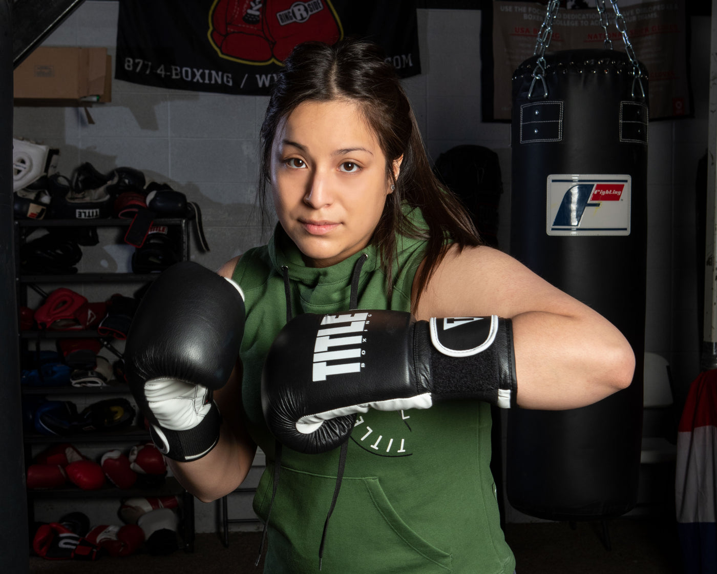 variant:Black/White::TITLE Boxing Dynamic Strike Heavy Bag Gloves girl posing in gloves
