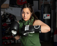 variant:Black/White::TITLE Boxing Dynamic Strike Heavy Bag Gloves girl posing in gloves