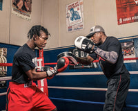 variant:lifestyle::TITLE Boxing Attack "Big-T" Punch Mitts 2.0 coach mitting