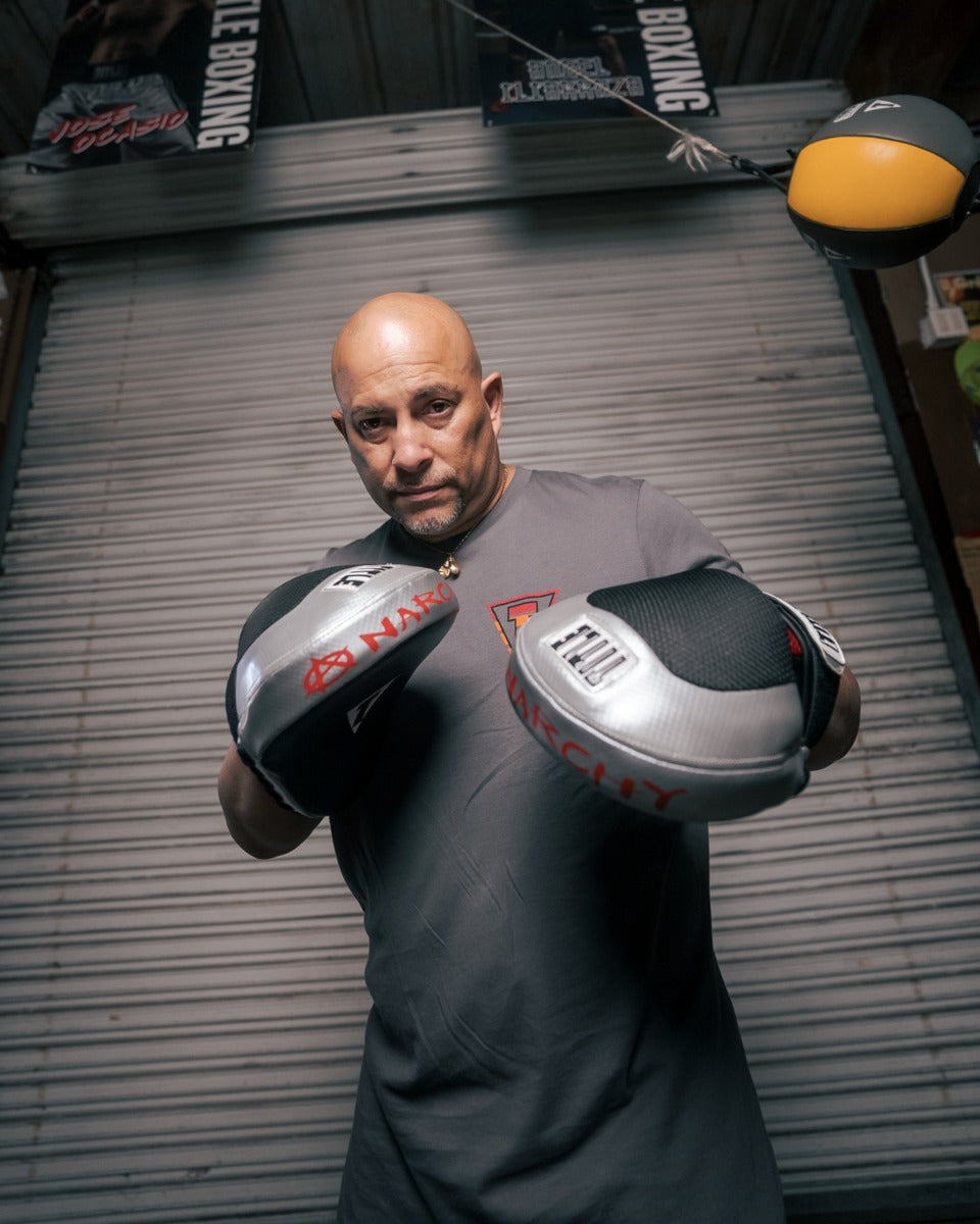 variant:lifestyle::TITLE Boxing Aerovent Anarchy Punch Mitts main view coach with mitts on 