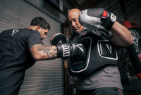 variant:lifestyle::TITLE Boxing Aerovent Elite Body Protector guy hitting protector