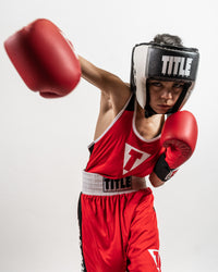 variant:black::TITLE Boxing Aerovent Elite USA Boxing Competition Headgear – Open Face kid throwing punch