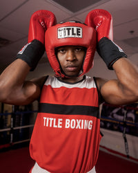 variant:red::TITLE Boxing USA Boxing Competition Headgear - Open Face guy hands on headgear on head