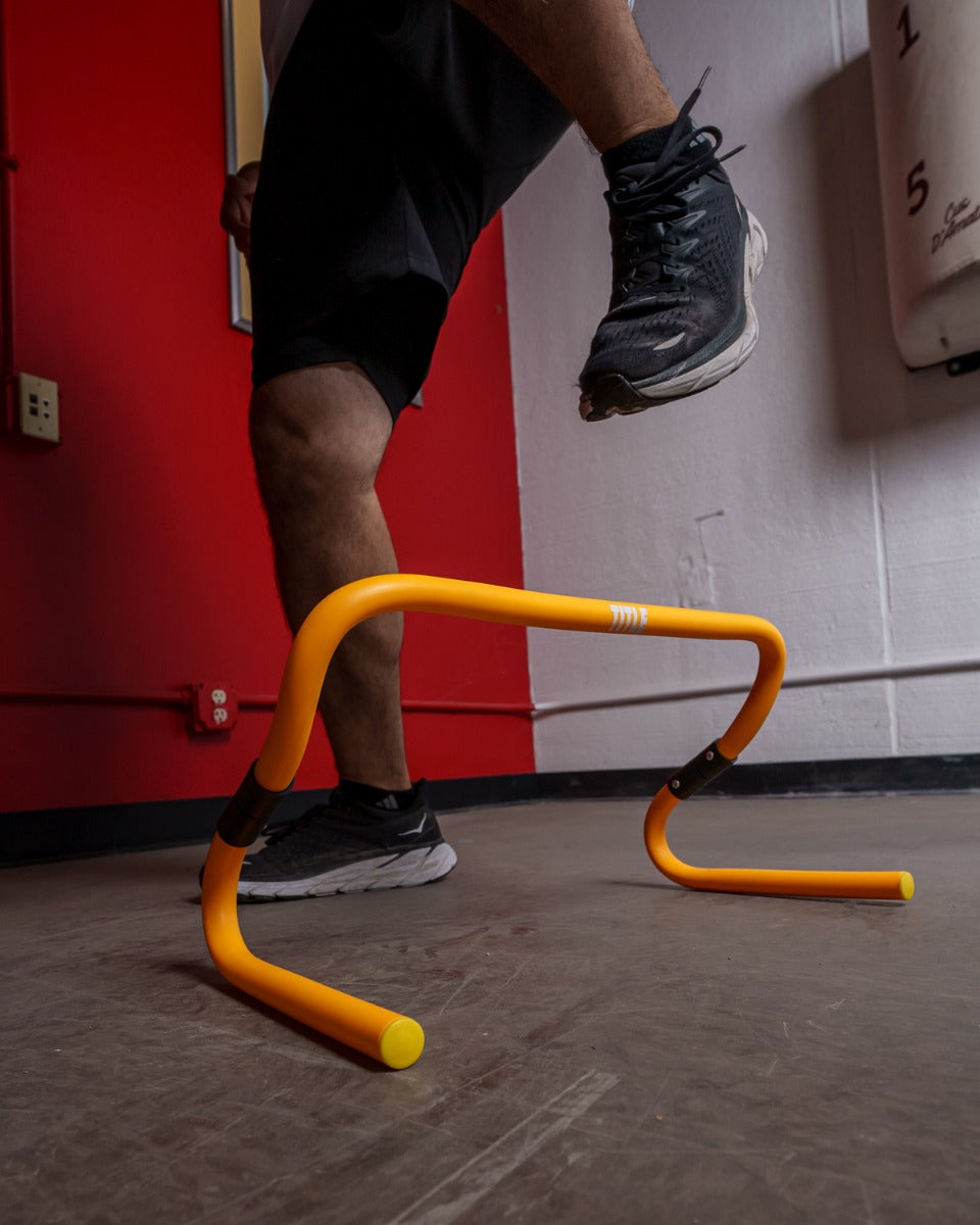 variant:lifestyle::TITLE Boxing Adjustable Speed & Agility Hurdle 2.0 being used by a boxer