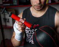 variant:lifestyle::TITLE Boxing Replacement Air Needles 2.0 being used to inflate a speed bag