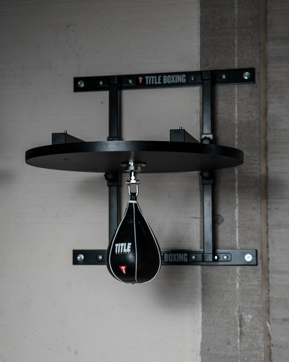 variant:lifestyle::TITLE Boxing Complete Professional Adjustable Speed Bag Platform with a speed bag attached
