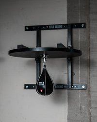 variant:lifestyle::TITLE Boxing Complete Professional Adjustable Speed Bag Platform with a speed bag attached