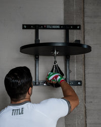 variant:lifestyle::TITLE Boxing Complete Professional Adjustable Speed Bag Platform in use in a boxing gym