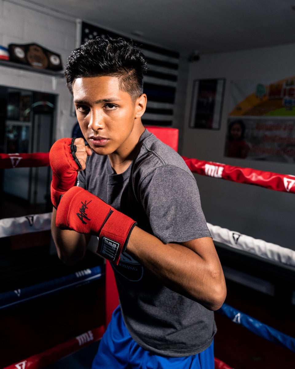 variant:red/black::TITLE Boxing Attack Nitro Speed Wraps 2.0 kid posing 