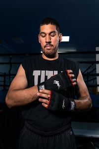 variant:lifestyle::TITLE Boxing Attack Nitro Speed Wraps guy putting wraps on