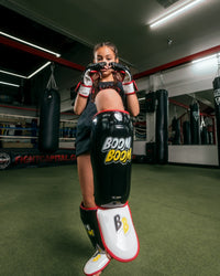 variant:Lifestyle::BOOM BOOM Boxing Bomber Youth Shin Guards girl posing