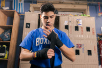 variant:Black::BOOM BOOM Boxing Youth Flex Hand Wraps kid putting on wrap