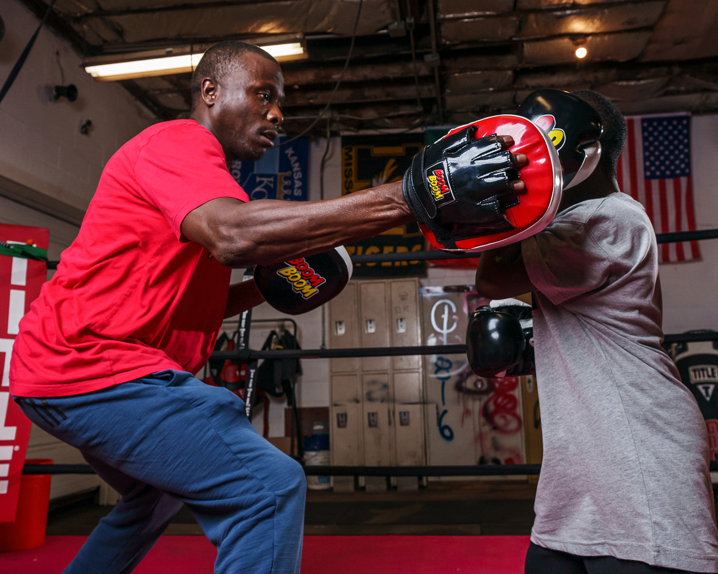 variant:lifestyle:: BOOM BOOM Boxing Silencer Youth Training Set 1 kid training with coach