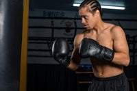 variant:lifestyle::TITLE Black Heavy Bag Gloves 2.0 kid boxing poseview