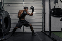variant:lifestyle::TITLE Black Lace Sparring Gloves 2.0 guy posing