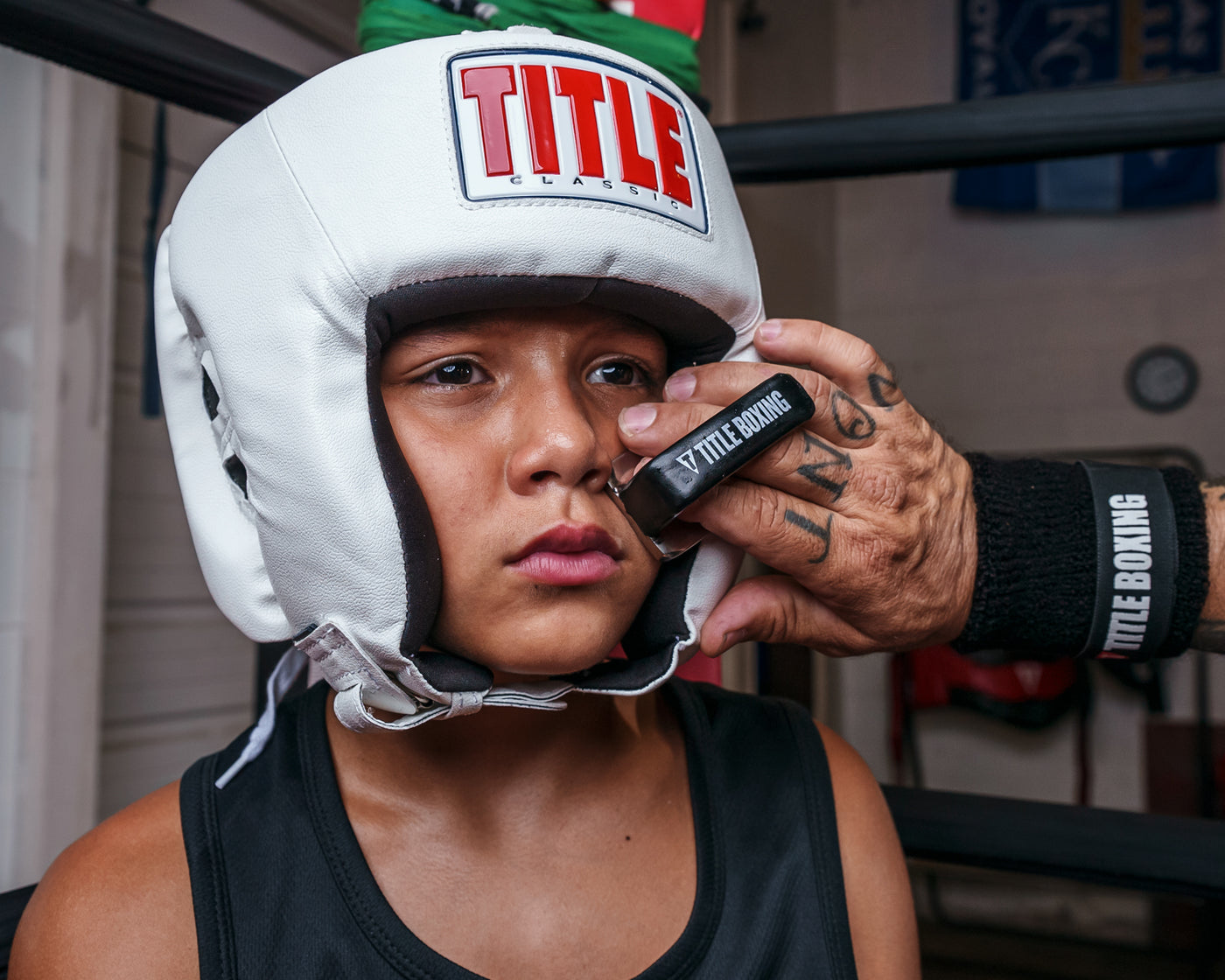 variant:lifestyle::TITLE Boxing Trainer’s No-Swell in use on a young boxer's face