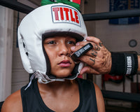 variant:lifestyle::TITLE Boxing Trainer’s No-Swell in use on a young boxer's face