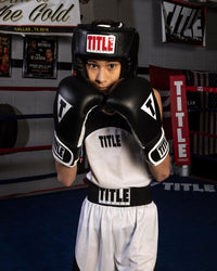 variant:black::TITLE Classic USA Boxing Competition Headgear – Open Face guy in white outfit