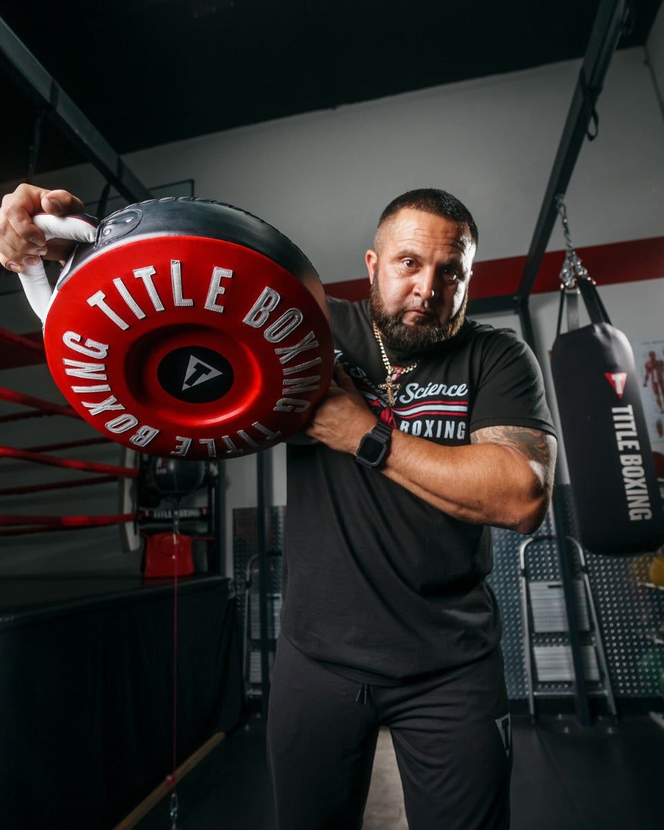 variant:lifestyle::TITLE Boxing Combination Punch Shield coach holding up