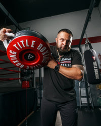 variant:lifestyle::TITLE Boxing Combination Punch Shield coach holding up