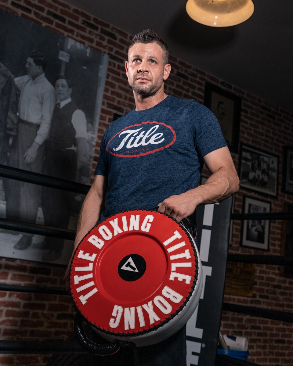 variant:lifestyle::TITLE Boxing Combination Punch Shield coach holding 