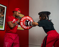 variant:lifestyle::TITLE Boxing Combination Punch Shield kid punching 