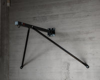 variant:lifestyle::TITLE Classic Heavy Bag Wall Hanger 2.0 on a wall