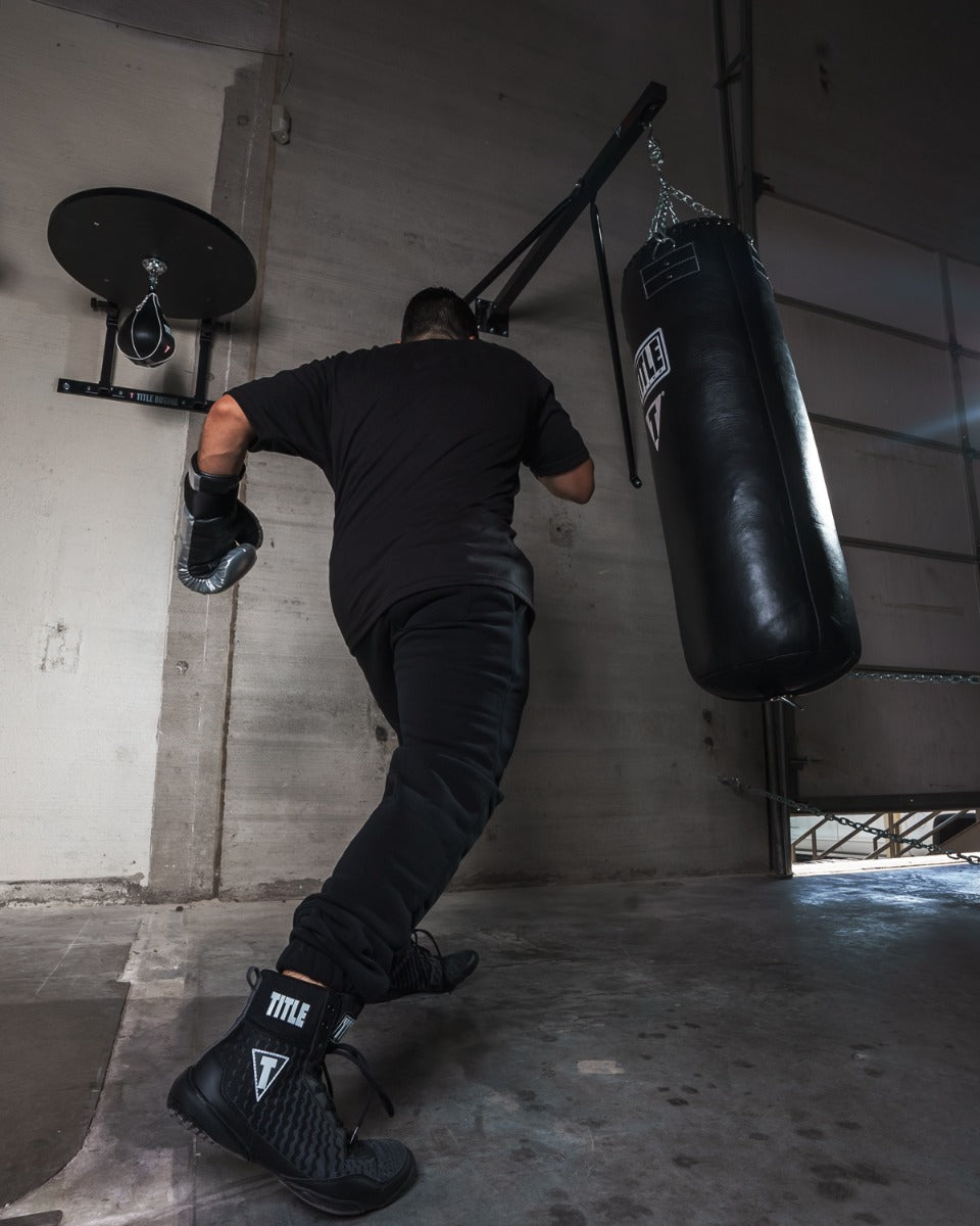 variant:lifestyle::TITLE Classic Heavy Bag Wall Hanger 2.0 in use with a heavy bag