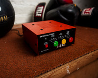 variant:lifestyle::TITLE Classic Personal Interval Timer on a shelf in a boxing gym