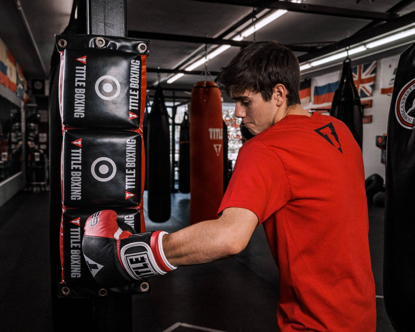 variant:lifestyle::TITLE Boxing Combination Punching Pad guy hitting