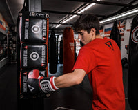 variant:lifestyle::TITLE Boxing Combination Punching Pad guy hitting