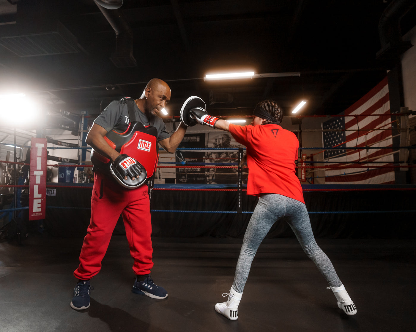 variant:lifestyle::TITLE Classic Command Body Protector 2.0 guy hitting mitts