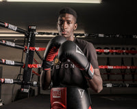 variant:black/red::TITLE Classic Fitness Boxing Gloves guy wearing gloves in ring