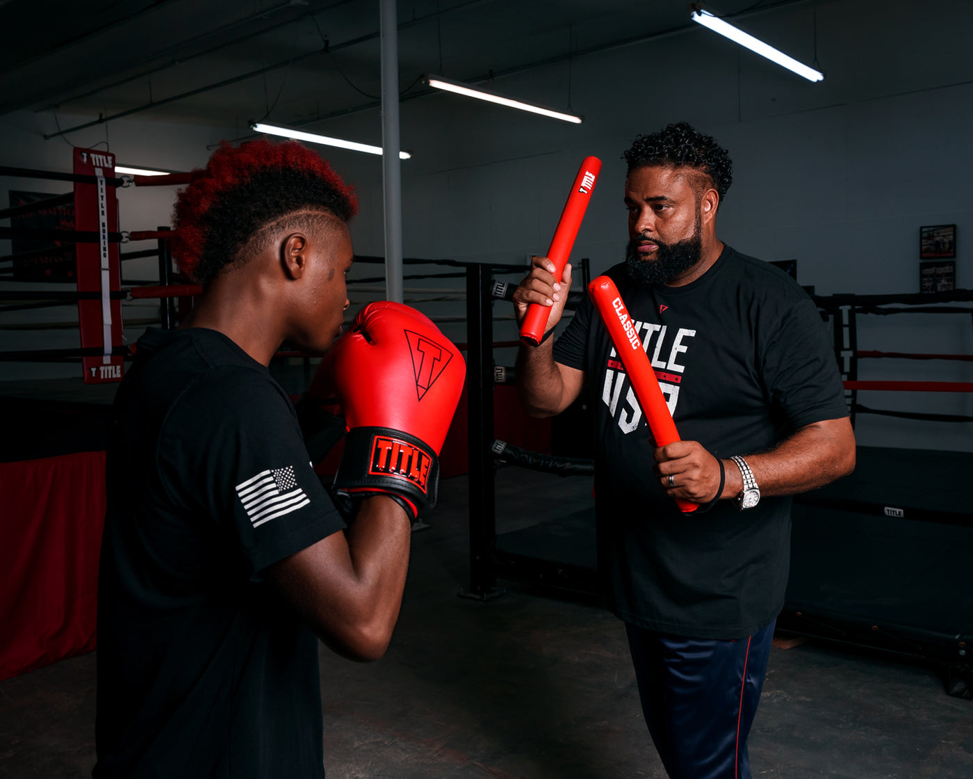 variant:lifestyle::TITLE Classic Striking Sticks 2.0 in use in a boxing gym