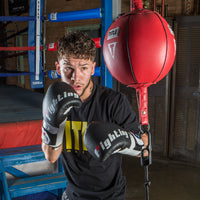 variant:7"::TITLE Boxing Double End Bag kid hitting double end bag